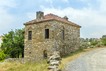 Fototapeta na wymiar Mugla, Turkey, 15 May 2012: Old Stone House at Village of Milas Cokertme