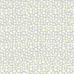 Snowflakes on a gray background seamless vector pattern. White irregular shaped dots. Scattered dots pattern. Perfect as background for Christmas. christmas packaging, cards, gift wrap.