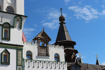 dome of an ancient wooden Church against the blue sky