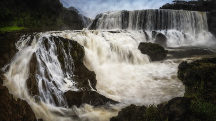 The powerful of Sae pong lai waterfall in Southern Laos