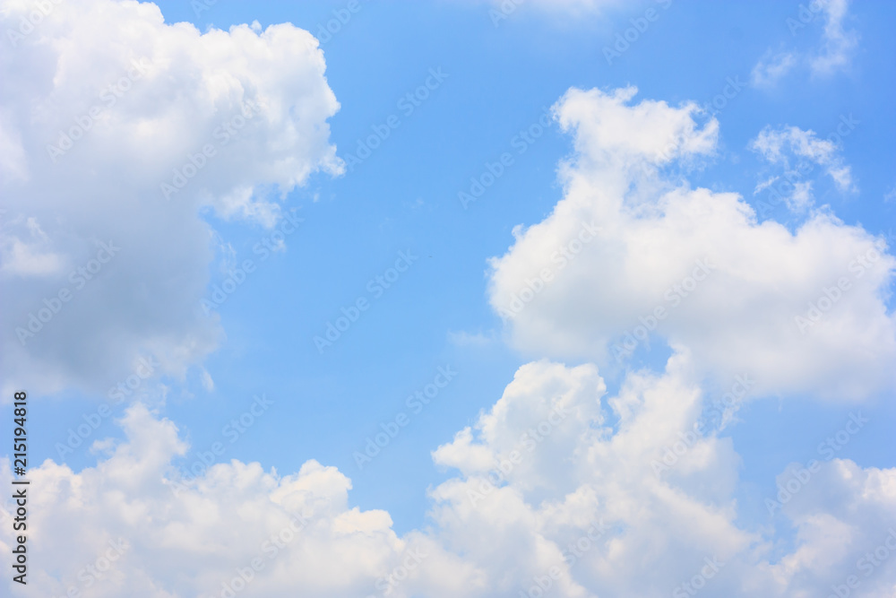 Wall mural fluffy cloud against blue sky background