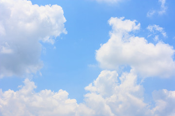 Fototapeta na wymiar Fluffy cloud against blue sky background