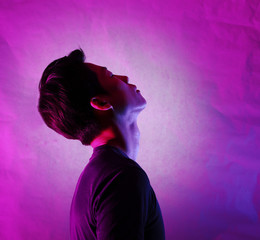 Silhouette of a man deep in thought. A side view of a person who is seriously concerned.