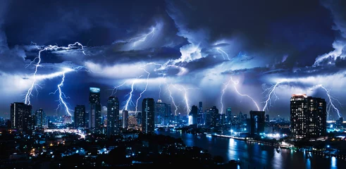 Gordijnen Lightning storm over city in blue light © stnazkul