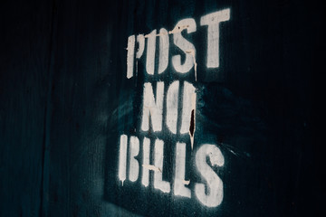 Post No Bills Stamp on Distressed Wall - 215197223