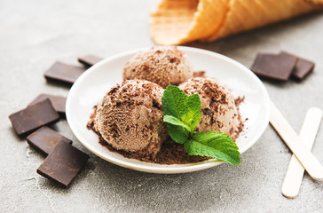 Chocolate ice cream on a stone background