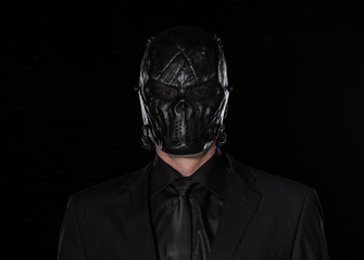 a man in a black mask on a black background