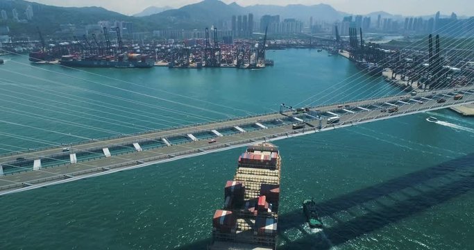 The cargo container vessel calls for loading into the container terminal of Hong Kong Aerial view 4K