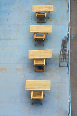 Wooden tables and chairs top view.