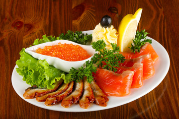 Trout fillet, red caviar and eel