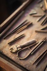 Carpentry tools on wood table background in the workshop room.