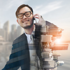 Double exposure businessman using mobile phone.