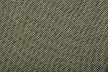 Cotton textured fabric of sports pants, green. texture of natural fabric.