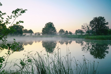 Morning fog on a quiet lake