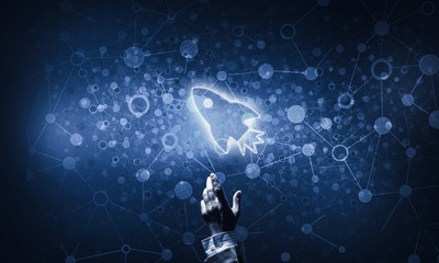 Fototapeta premium Technology idea concept with glowing rocket icon and touching it