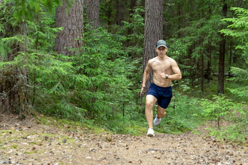 The athlete runs across the rough terrain