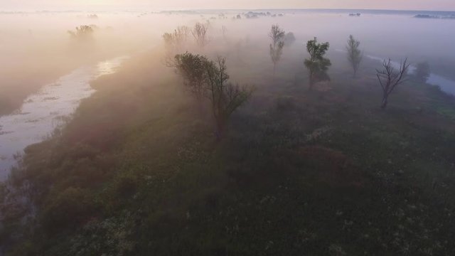 4K Aerial footage video of foggy morning. Flying over the Desna river. Sunrise time. Kyiv region, Ukraine.