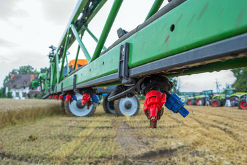 a modern sprayer bar with various nozzles for different conditions of application of chemistry....