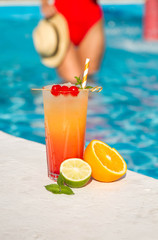 tropical cocktail on a pool background