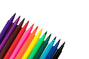 Colored markers isolated on white background. School study art concept
