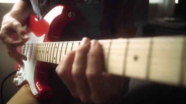 The guy plays the electric guitar