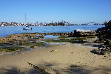 Deserted Milk Beach in Winter with a View of Sydney's Skyline on the Horizon