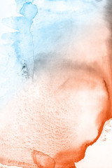 Blue and orange watercolor paint background.
