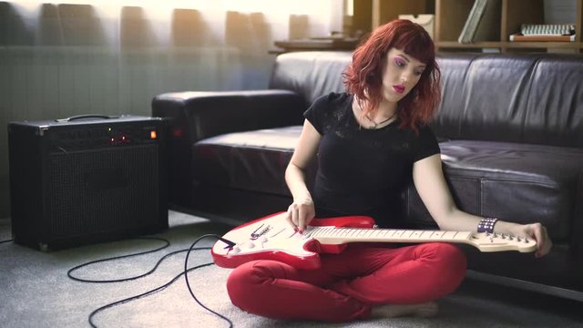 Girl playing electric guitar