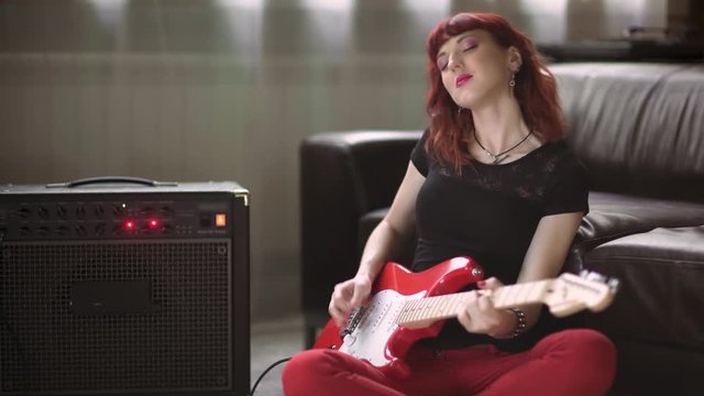 Girl playing electric guitar