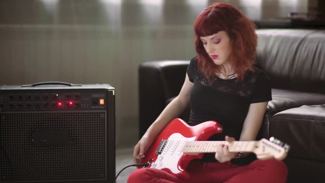 Girl playing electric guitar
