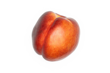 One whole ripe deep red nectarine flatlay isolated on white