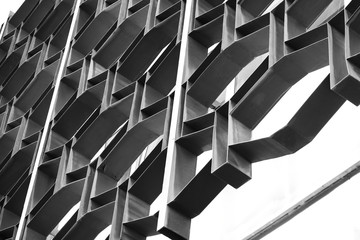 Decorative metal lattice on a windows on a facade of a building. Architecture details