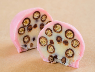 White chocolate truffle in strawberry glaze