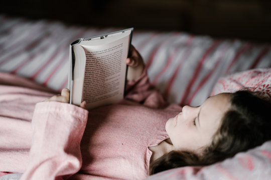 Child Reading A Bedtime Story Book