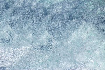 Aquatic background of sea surf waves close up with clear water and white foam