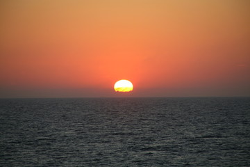 The sun falls into the Ocean. 001.