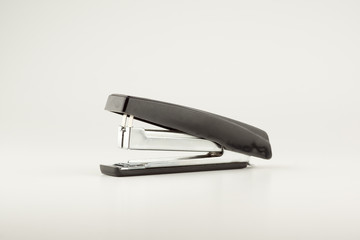 stapler for stapling papers on a table