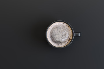 a cup of strong coffee on a black background