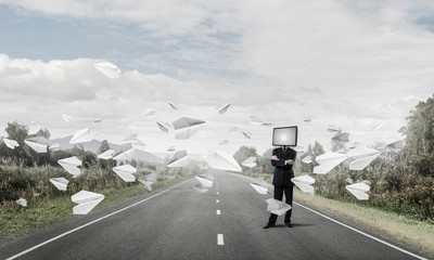 Businessman with TV instead of head.