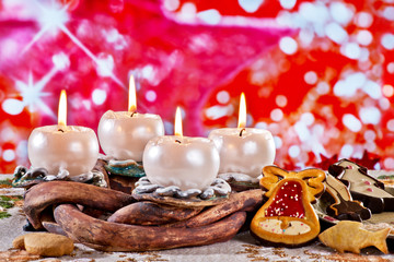 Advent Wreath with Burning Candles on the Red Background