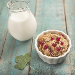 White bowl with corn cereals oatmeal flakes
