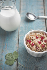 White bowl with corn cereals oatmeal flakes