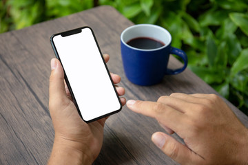 Male hands holding phone with isolated screen in cafe