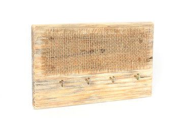 Wooden hanger on a white background. Housekeeper. Handmade