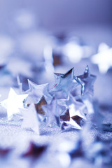 Silver Christmas composition with tiny stars sparkling