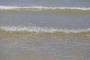 Lake Water Surface with Small Waves on Warm Sunny Bright Summer Day with No People. Lake Shore Water Background near Coastal Line with Sun Reflections, Nature Scenic Seascape