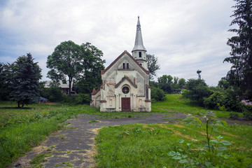 Fototapeta na wymiar Old abandoned church against dramatic dark sky