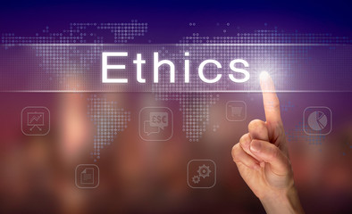 A hand selecting a Ethics business concept on a clear screen with a colorful blurred background.