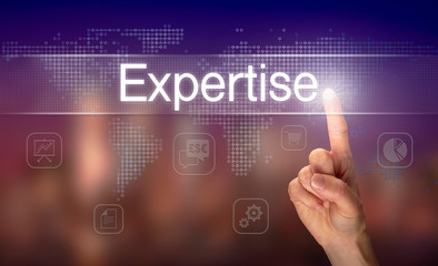 A hand selecting a Expertise business concept on a clear screen with a colorful blurred background.