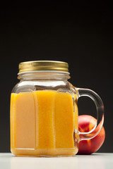 peach or nectarine juice in closed jar